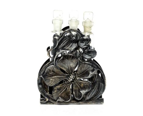 An Art Nouveau white metal perfume holder. cast and reticulated in the form of a flower, holding three glass files for scent,