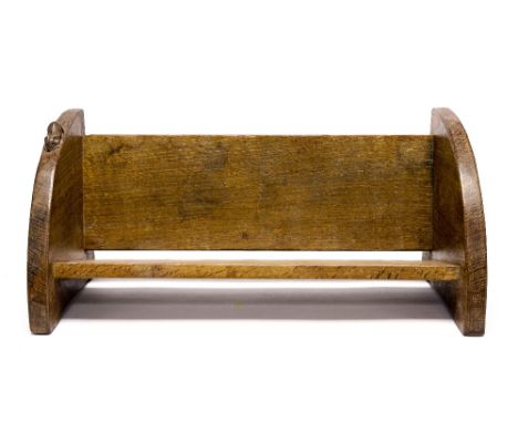 Robert Mouseman Thompson of Kilburn, an Arts and Crafts carved oak book trough, the segmented ends united by plain plank boar
