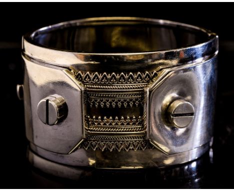 A Victorian silver bangle, filigree banding and screw tongues, in the Industrial, Anglo Persian style, Saunders and Shepherd 