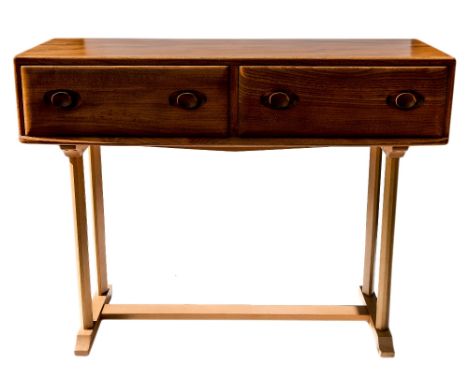 An Ercol Windsor console or side table, light elm and ash, double drawers raised on chamfered legs united by a low H stretche