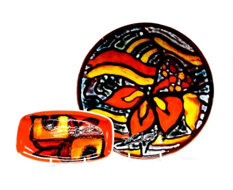 A Poole Pottery Delphis plate, decorated by Christine Tate, pattern 4, 27cm diameter, together with a small rectangular dish,