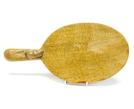 A Robert 'Mouseman' Thompson of Kilburn, a carved oak cheese board, with handle, adzed surface, oval form, 36cm long