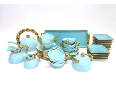 A 'CERENNE VALLOURIS' TWELVE SETTING TEA SERVICE on a turquoise ground with gilt borders and rope twist handles, the teapot 1