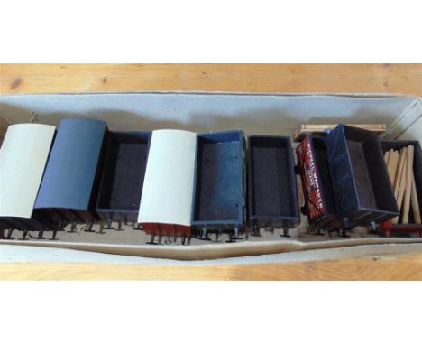 [O GAUGE]. NINE ASSORTED WAGONS comprising two Leeds Model Co. open wagons; an R.F. Stedman open wagon; and six other wagons,