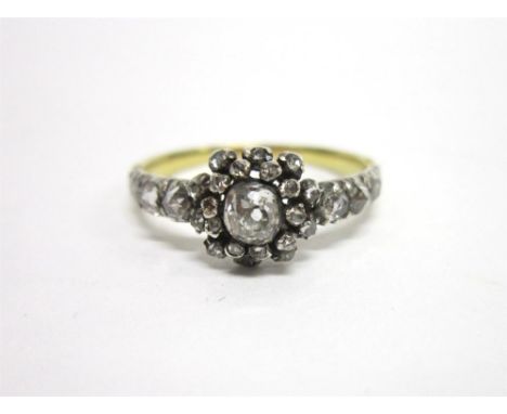 A VICTORIAN DIAMOND CLUSTER RING the central collet set old cut brilliant of approximately 0.2 carats, enclosed by rose diamo
