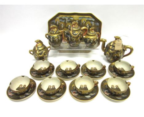A JAPANESE SATSUMA EARTHENWARE TEA AND COFFEE SERVICE Meiji period, comprising dragon moulded lidded tea and coffee pot, simi