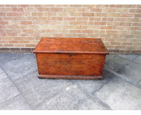 A VICTORIAN PINE TRUNK with iron carrying handles, 96cm wide 54cm deep 46cm high