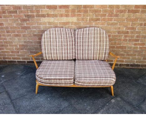 AN ERCOL LIGHT ELM TWO SEAT SOFA  with original fabric