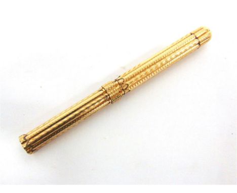 A VICTORIAN GILT METAL PROPELLING DIP PEN/PENCIL of octafoil outline with engine turned decoration, W. S. Hicks, New York, pu