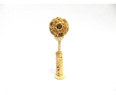 A LATE 19TH CENTURY CHINESE IVORY PUZZLE BALL ON AN ASSOCIATED STAND the floral decorated outer ball with six concentric inne