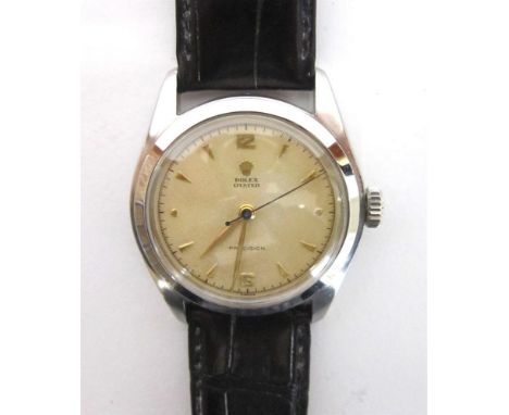 ROLEX, OYSTER PRECISION, A GENTLEMAN'S STAINLESS STEEL WRIST WATCH the signed dial with gilt dagger batons, dots at the 3 and