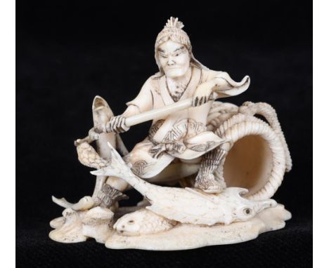 A JAPANESE CARVED IVORY OKIMONO NETSUKE Meiji period, depicting a fisherman in martial pose, beside a large wicker basket, wi