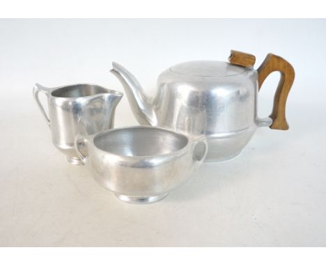 PICQUOT WARE STAINLESS STEEL TEA SERVICE
comprising a tea pot, milk jug and oval sugar bowl 