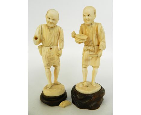 JAPANESE CARVED IVORY FIGURE OF A FARMER
holding a rake with a pouch to his waist, 17cm high; together with another of a man 