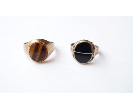 TWO GOLD SIGNET RINGS
one set with tiger's eye on unmarked gold shank, the other set with agate on nine carat gold shank, rin
