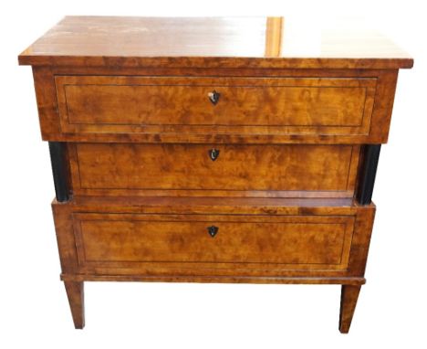 19th CENTURY GERMAN BIEDERMEIER BURR BIRCH COMMODE
with three ebony inlaid drawers, the middle recessed drawer flanked by col