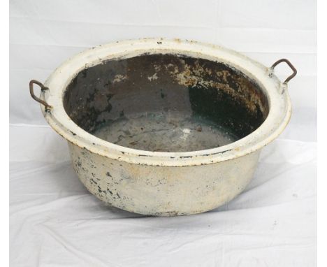 CAST IRON CIRCULAR PLANTER
with carrying handles and bearing a plaque Husieres No.85, 79cm diameter
