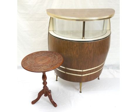 1960's HOME BAR 
with a simulated walnut half round top above a glass front illuminated shelf with another shelf below, the f