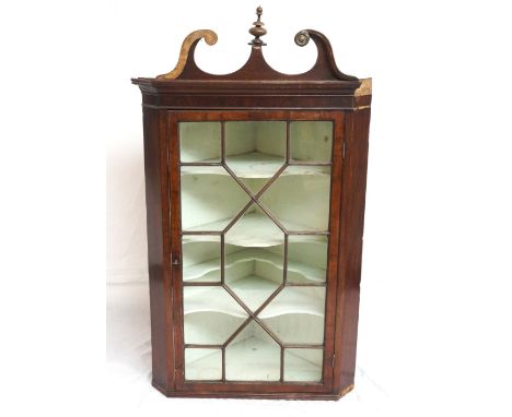 GEORGIAN MAHOGANY CORNER CABINET
with brass mounted swan neck pediment with central turned finial, astragal glazed door and s