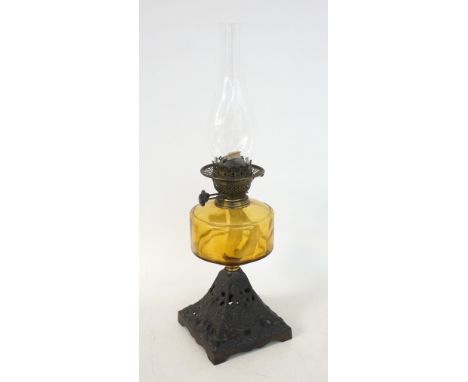 VICTORIAN OIL LAMP
the pierced metal tapering square base below a yellow glass reservoir, 57cm high 