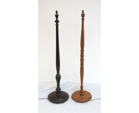 EARLY 20th CENTURY OAK FLOOR LAMP
on circular base raised on bun feet, and an Indonesian wooden floor lamp with carved decora