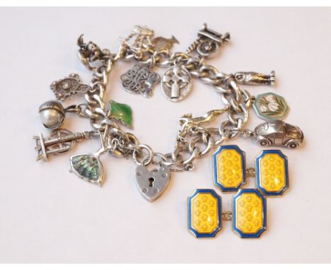 SILVER CHARM BRACELET
with various charms including a spinning wheel, a set of bagpipes set with citrine, a fish and a car; t