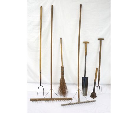 SELECTION OF VINTAGE GARDEN TOOLS
including two wood garden rakes, pitch fork, garden fork, besom broom, drain spade and a ta