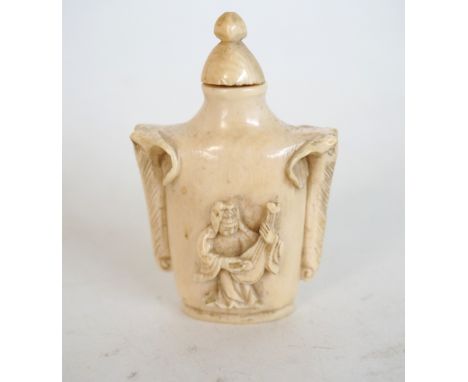 CHINESE CARVED IVORY SNUFF BOTTLE
with elephant masks and a gentleman playing the pipa, 6cm high 