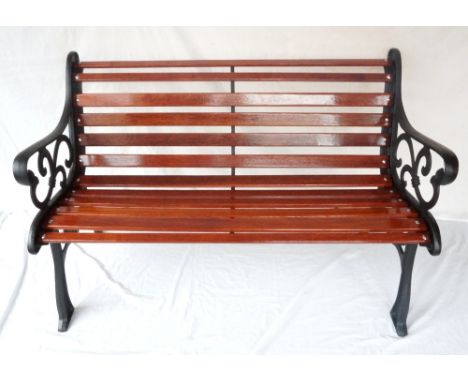 VICTORIAN STYLE GARDEN BENCH
with shaped cast iron end supports and a slatted padouk seat and back, 121cm wide  