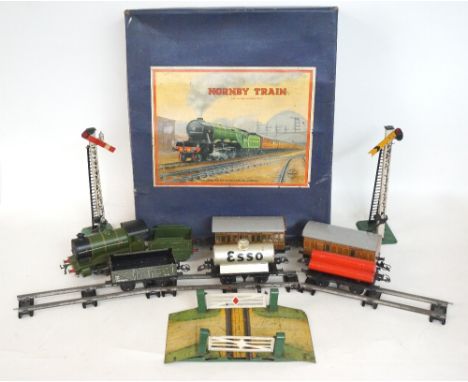 CLOCKWORK HORNBY TRAIN SET
including No 501 passenger set, boxed, gas cylinder wagon, Esso petrol tank wagon, selection of tr