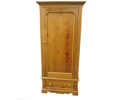 PINE WAXED WARDROBE
with a moulded top above a panelled door with a drawer below, with a shaped apron and bracket feet, 92cm 
