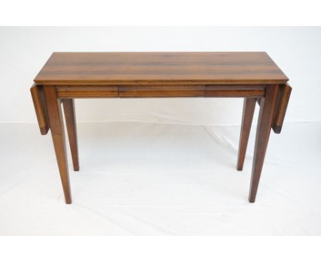 MODERN MAHOGANY SOFA TABLE
with drop flaps and a frieze drawer, standing on tapering supports, 167cm wide overall 