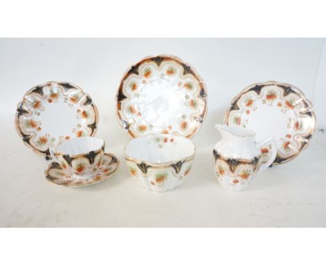 EDWARDIAN MELBA CHINA TEA SET
with floral and gilt decoration on a white ground, comprising twelve cups, twelve saucers, twel
