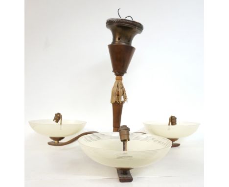 1950's WALNUT PENDANT LIGHT
with three shaped arms with frosted glass bowl shades, supported by a central turned column, appr