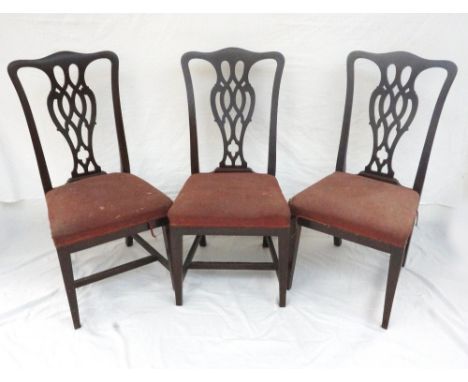 SET OF SIX EDWARDIAN OAK CHIPPENDALE STYLE DINING CHAIRS
with shaped splats and raised on square legs with stretchers (marked