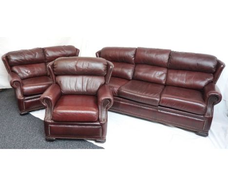 PENDRAGON BROWN LEATHER SUITE
comprising a three seat and two seat sofa and matching armchair, all with decorative stud detai