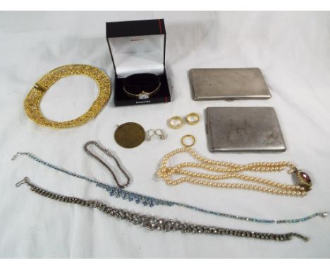 A good mixed lot to include a double stranded pearl necklace with stone set clasp, two white metal cigarette cases, a quantit