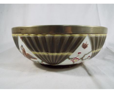 An early Victorian Wedgwood ceramic glazed bowl with a silver plated rim. Estimate £20 - £40