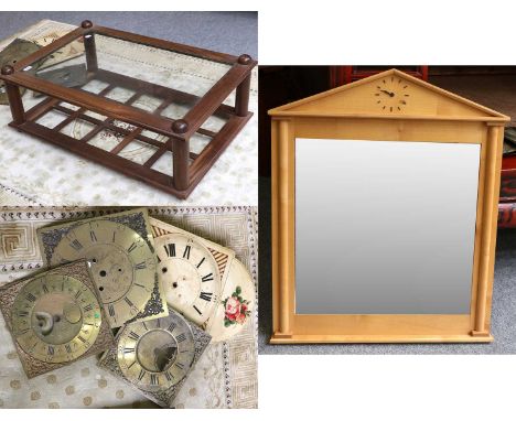 A Reproduction Laburnum Glazed Coffee Table, sycamore framed architectural mirror; together with four 19th century clock face