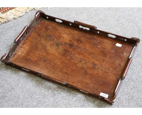 A George III Figured Mahogany Butlers Tray, with carved scroll and openwaork sides, 63cm by 41cmFull gallery repair, reasonab