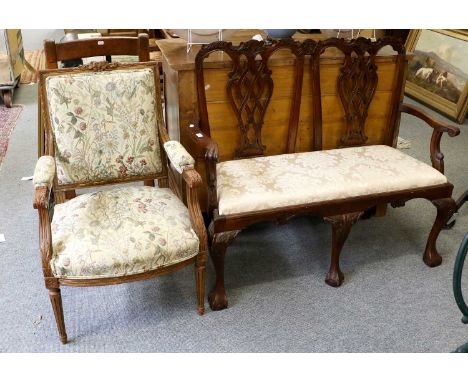 A Chippendale Style Bench, with drop in seat upholstered in a cream floral fabric, 117cm by 47cm by 101cm, and a carved walnu