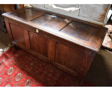 A 18th Century Oak Three Panel Coffer, 150cm by 54cm by 71cmThe central and left top panels are split. Lock removed and hinge
