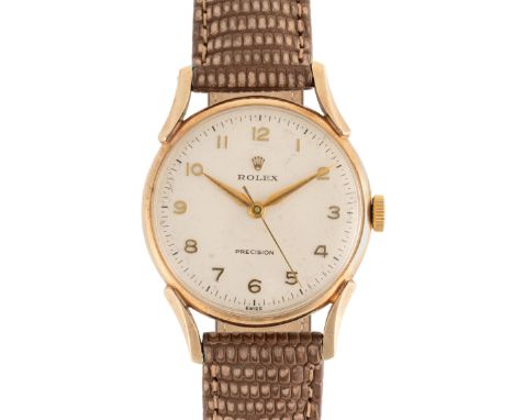 A GENTLEMAN'S SIZE 9CT SOLID GOLD ROLEX PRECISION WRIST WATCHCIRCA 1960s, REF. 12857 WITH SCALLOPED LUGS Movement: 17J, manua