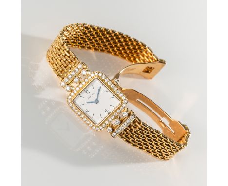 A LADY'S FINE & RARE 18K SOLID GOLD & DIAMOND CARTIER BRACELET WATCHCIRCA 1980, REF. 18002 WITH VACHERON CONSTANTIN MOVEMENT 