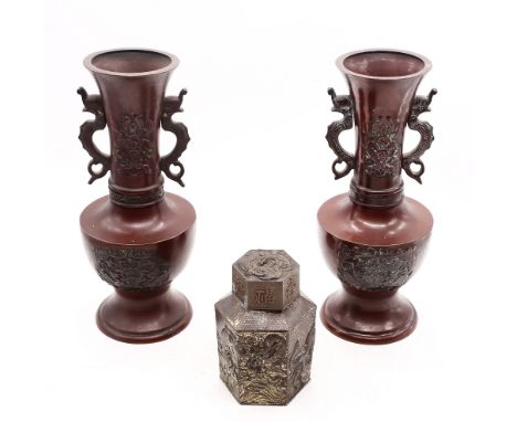 A pair of Japanese patinated bronze two handled vases and a tea caddy.