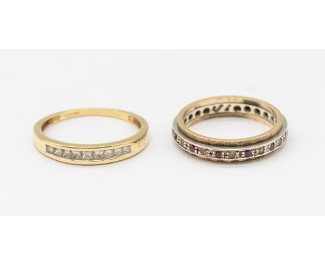 A ruby and white stone set 9ct gold full eternity ring, width approx 4mm,  size K (some replacement stones), along with a dia