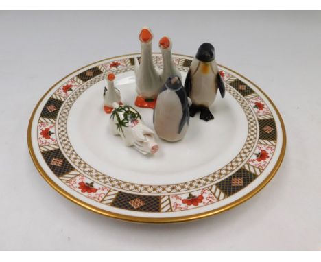 A Beswick part Goose family, couple together and single young Gosling, a Royal Copenhagen small Penguin, model no. 3003, a Go