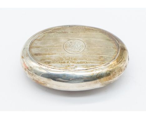 A George V oval silver snuff box, with engine turned banded designed top and circular initialled cartouche to centre, hallmar