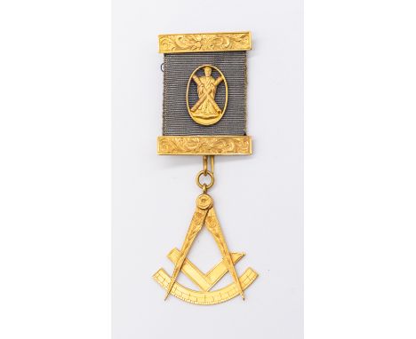 Masonic Interest- a 9ct gold medallion, the blue ribbon with 9ct gold (marked) foliate engraved panels, suspending a 9ct gold