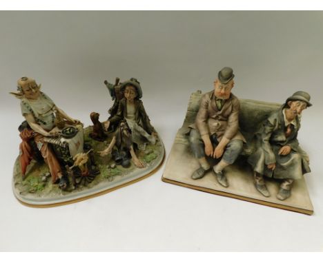 Two Capo De Monte sculptures of two men sat on a bench and two tramps cooking chicken on a spit, both appear in good overall 